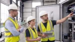 Manufacturing supervisor listening to employees during a production issue.